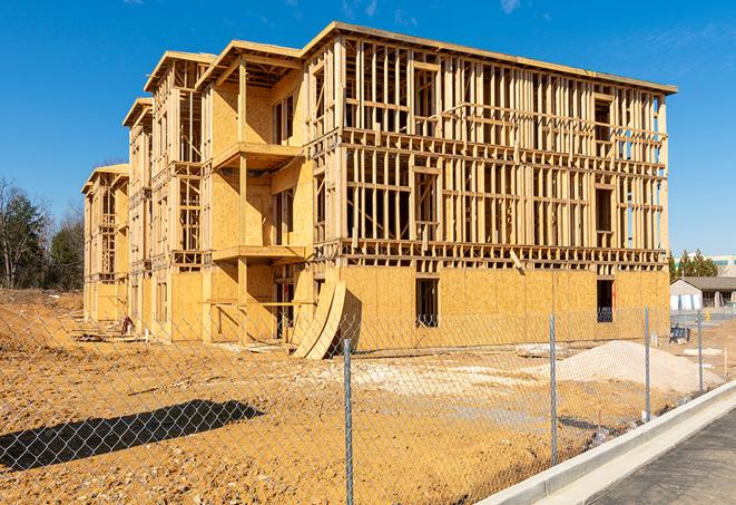 a snapshot of temporary chain link fences protecting a large construction project from unauthorized access in Garden City